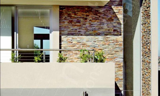 Ochre Rock Panels on a Stacked Stone Facade