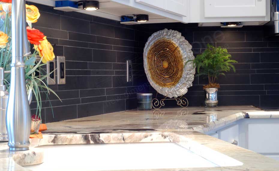 Norstone Ebony Basalt Stone Veneer Backsplash in a kitchen with under cabinet lighting in Chicago