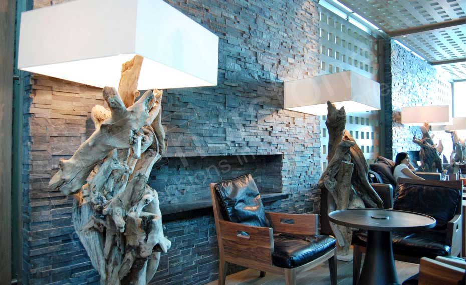 Norstone Charcoal Rock Panels used for as a Natural Stacked Stone Veneer Wall and Fireplace in Airport Lounge in Dubai