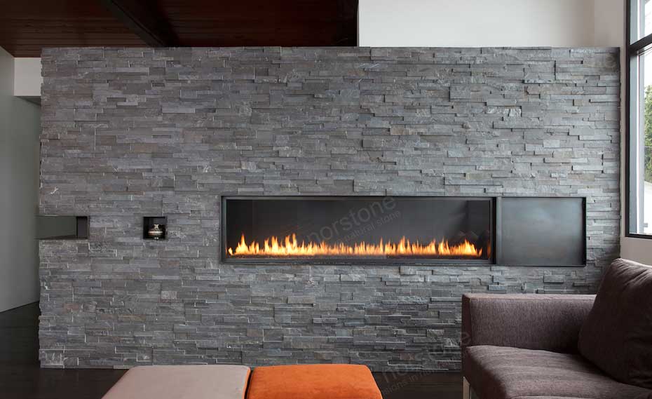 A Stacked Stone Fireplace in a modern living room environment with a flame