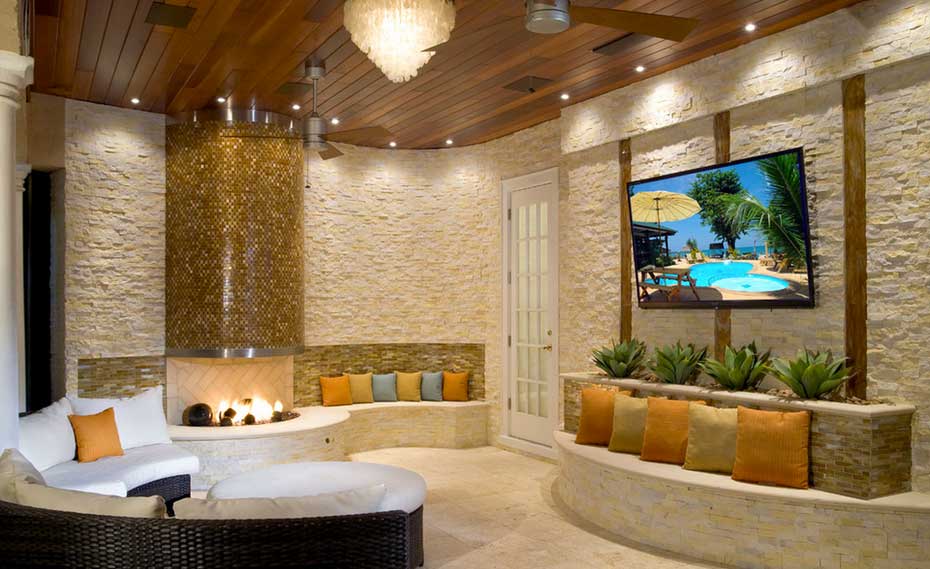 Outside Stone Fireplace Entertainment Center with creamy Ivory Rock Panel Facade in Tampa Florida