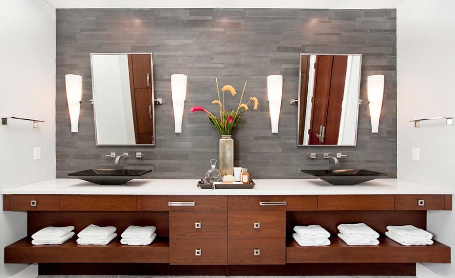 Norstone Grey Basalt Stone Veneer Backsplash Used in a Bathroom with modern brown cabinet vanity and his and hers sink