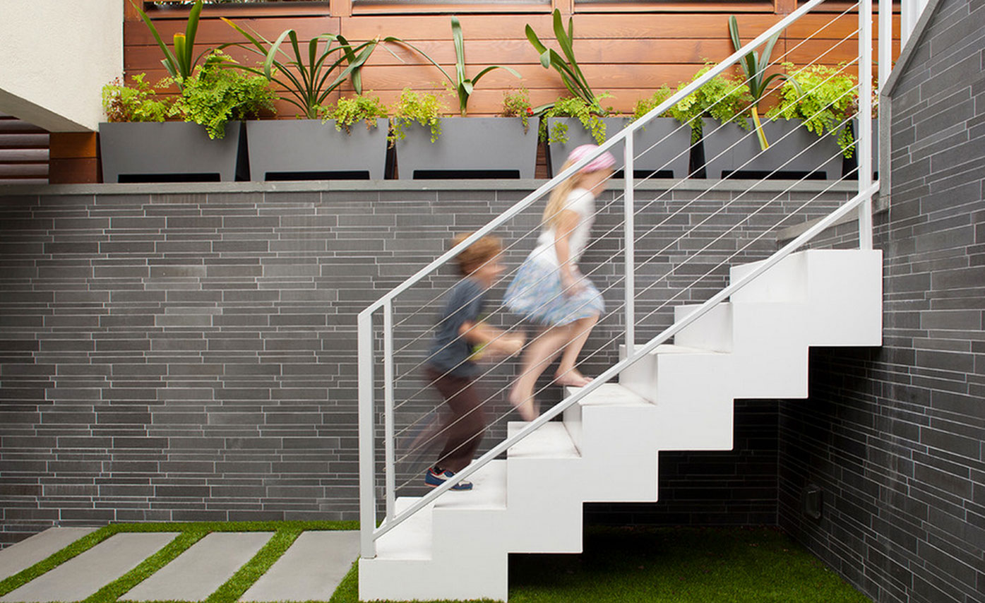 Clean linear basalt strip veneer on interior courtyard of residence in San Francsico