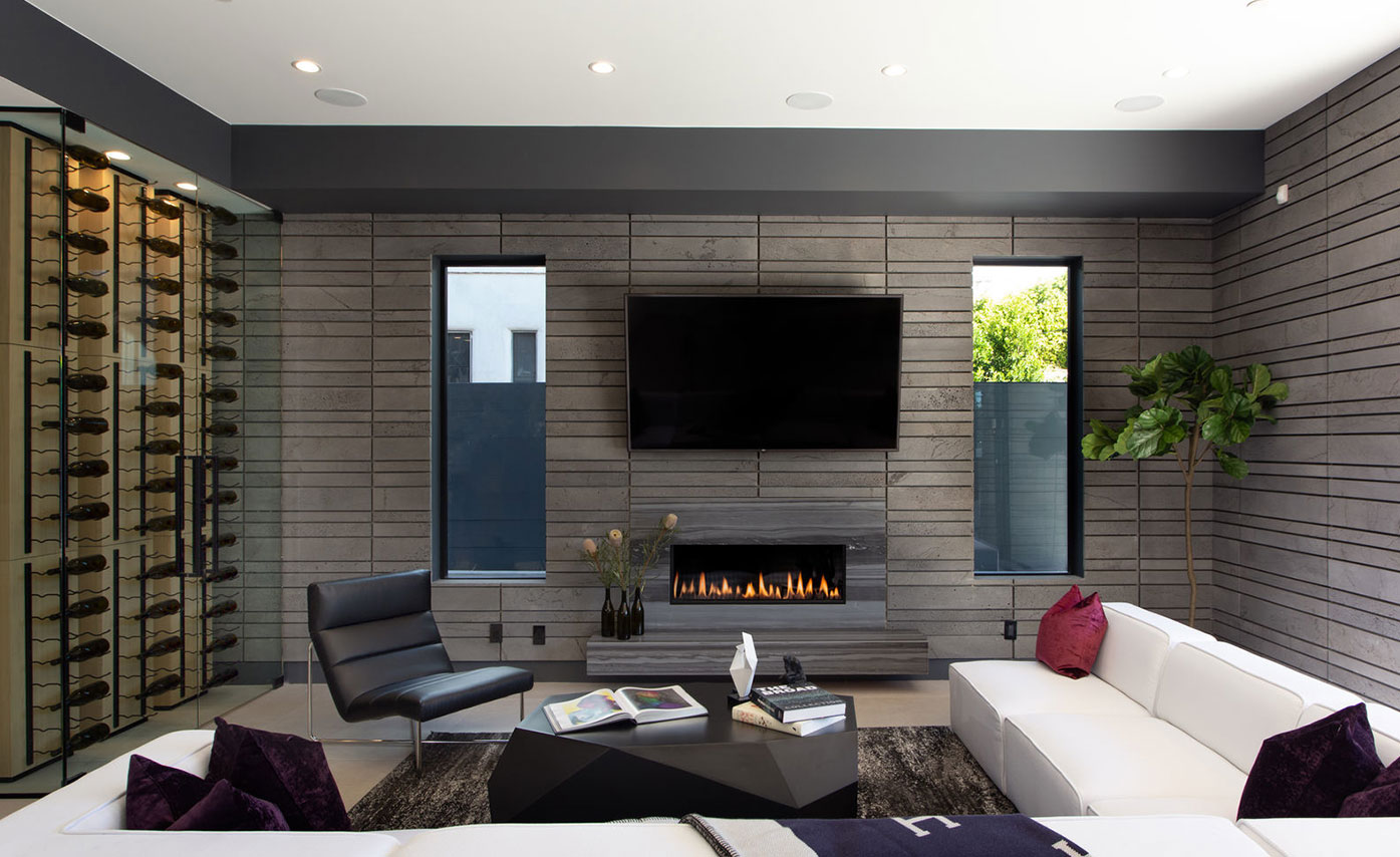 A Stunning Interior Fireplace in West Los Angeles using Norstone's Lavastone PLANC in a straight stack tile formation with custom spacers