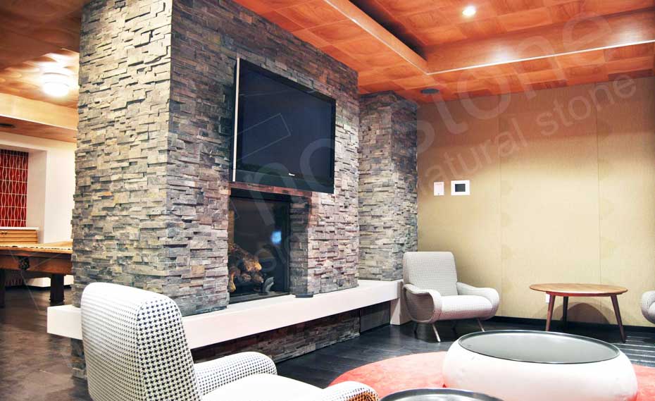 Norstone Charcoal Rock Panels used on a common room fireplace on John St in New York City