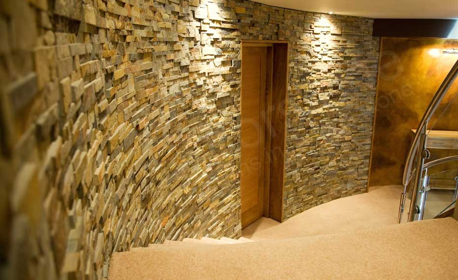 Dimensional Interior Stone Veneer Radius Wall with a door in a residential stairwell