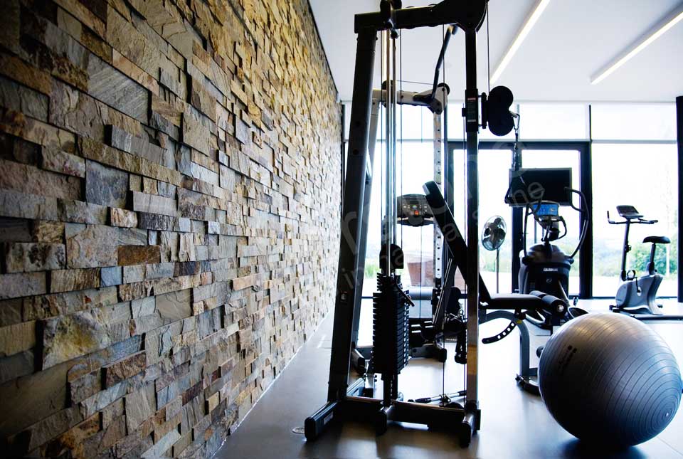 Interior Beautiful Stacked Stone Feature Wall in Gym
