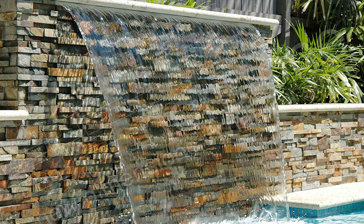Ochre Stone Panel used on pool riser and water feature