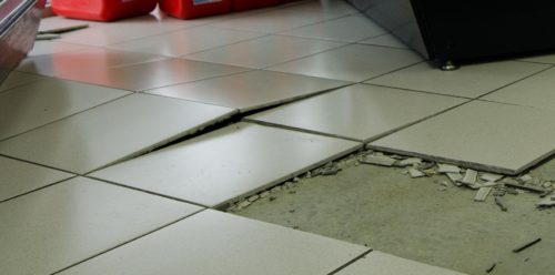 Tiles that have buckled due to lack of an expansion joint