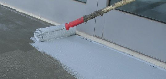 Applying a fabric waterproofing membrane for a tile installation