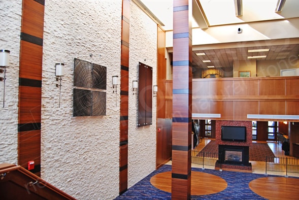 Norstone White Quartz Stone Veneer installed in a multi story hotel lobby