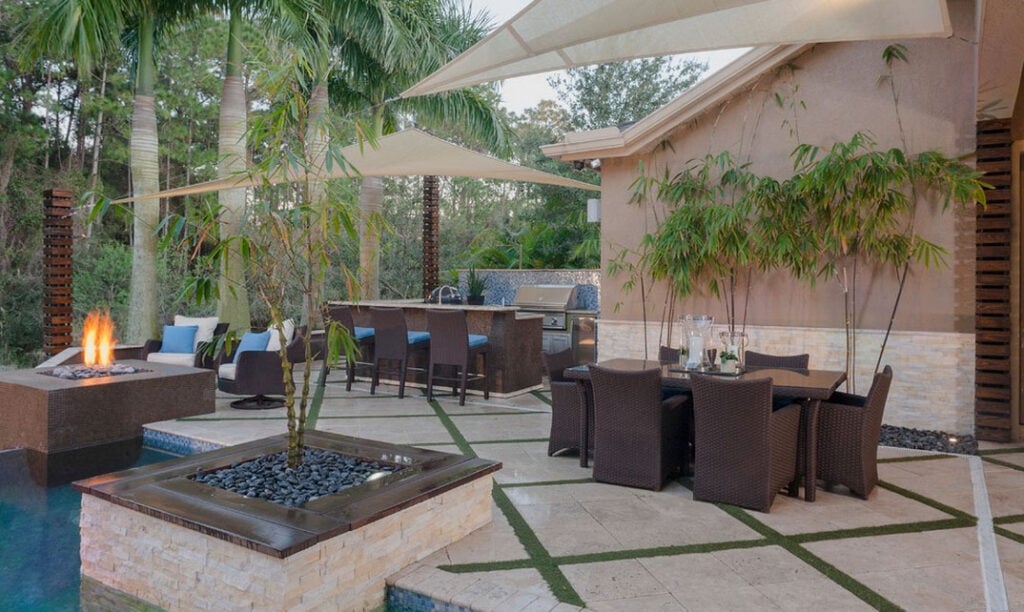 Ivory Rock Planters used in a pool and outdoor back patio living environment