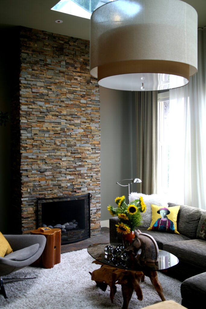 Ochre Stacked Stone Floor to Ceiling Fireplace