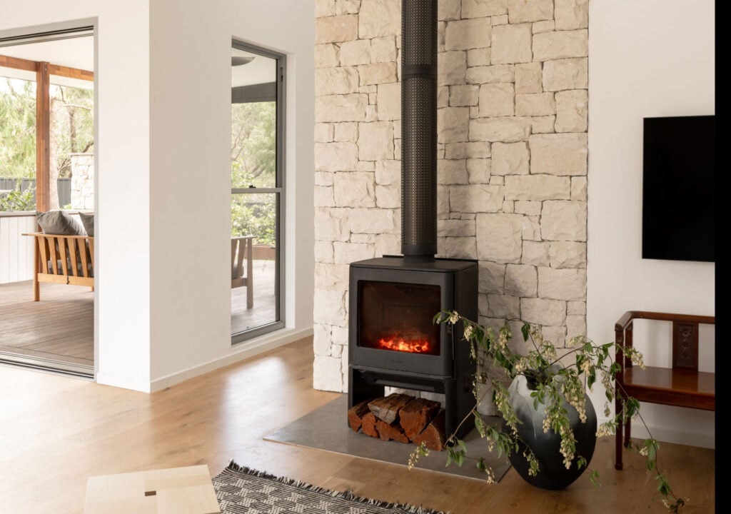 White Ashlar Limestone behind Fireplace Stove